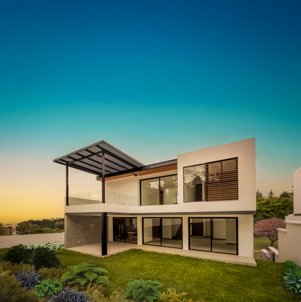 Fachada posterior de casa moderna de dos niveles con terraza ventanales amplios y jardín en un entorno residencial rodeado de naturaleza Deconsa sauces de el pulté